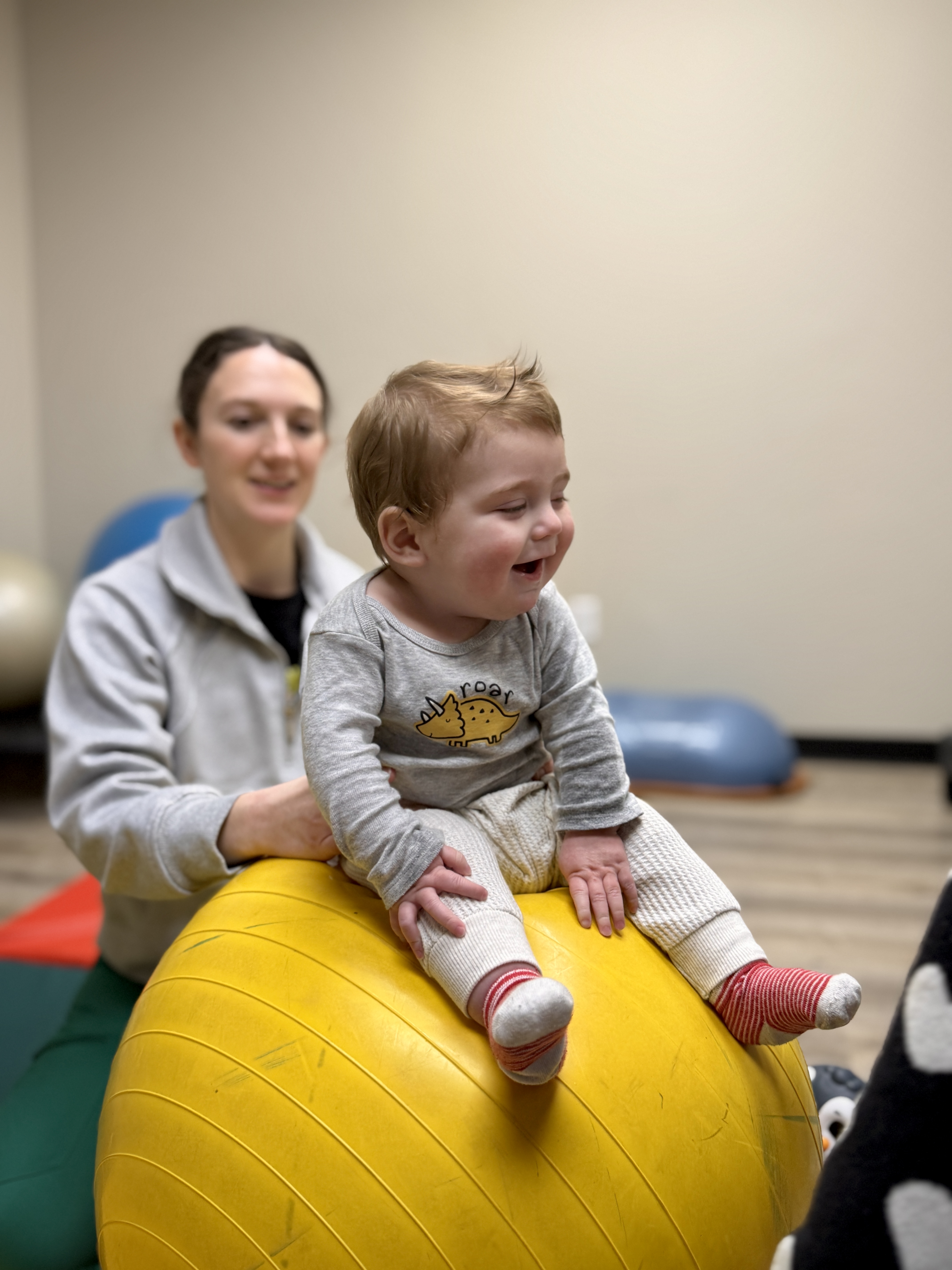 Brooks smiling during a therapy exercise