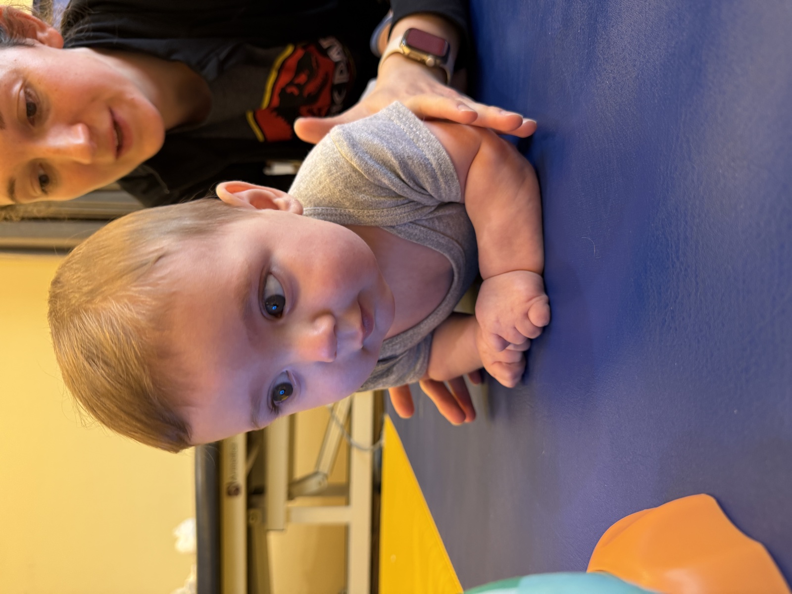 Brooks practicing movement with support from his therapist