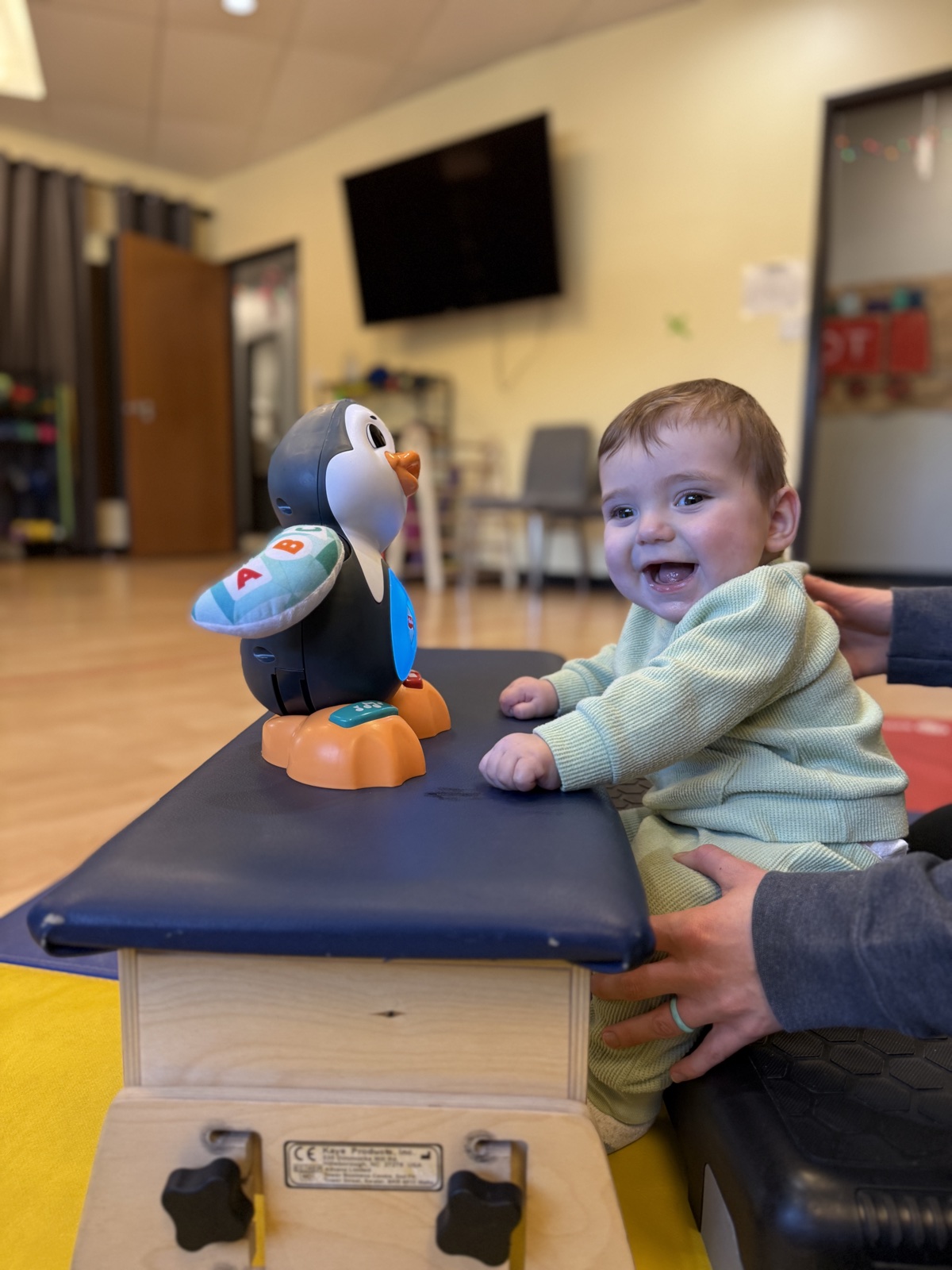 Brooks smiling during a therapy activity
